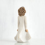 Back view of curly hair girl figurine in white dress standing up