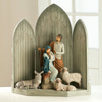 Light grey barn figurine with nativity scene figurines and white lambs/donkeys