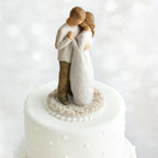 Willow Tree Promise Cake Topper, 6”h hand-painted resin figure of standing couple embracing or dancing, both in neutral colors, affixed to 3.5" diameter food-safe base carved with white roses
