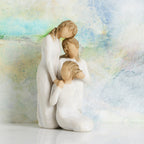 Willow Tree Our healing touch, 6.5”h hand-painted resin figure of three women; one standing with arm around kneeling girl, holding hand of seated girl, kneeling girl arranging hair of seated girl, all in cream dresses, in front of pastel painting