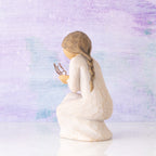 Willow Tree Quiet Wonder, 3.5”h hand-painted resin figure, kneeling in cream dress with gold leaf wire butterfly on extended hands, in front of lavender painting