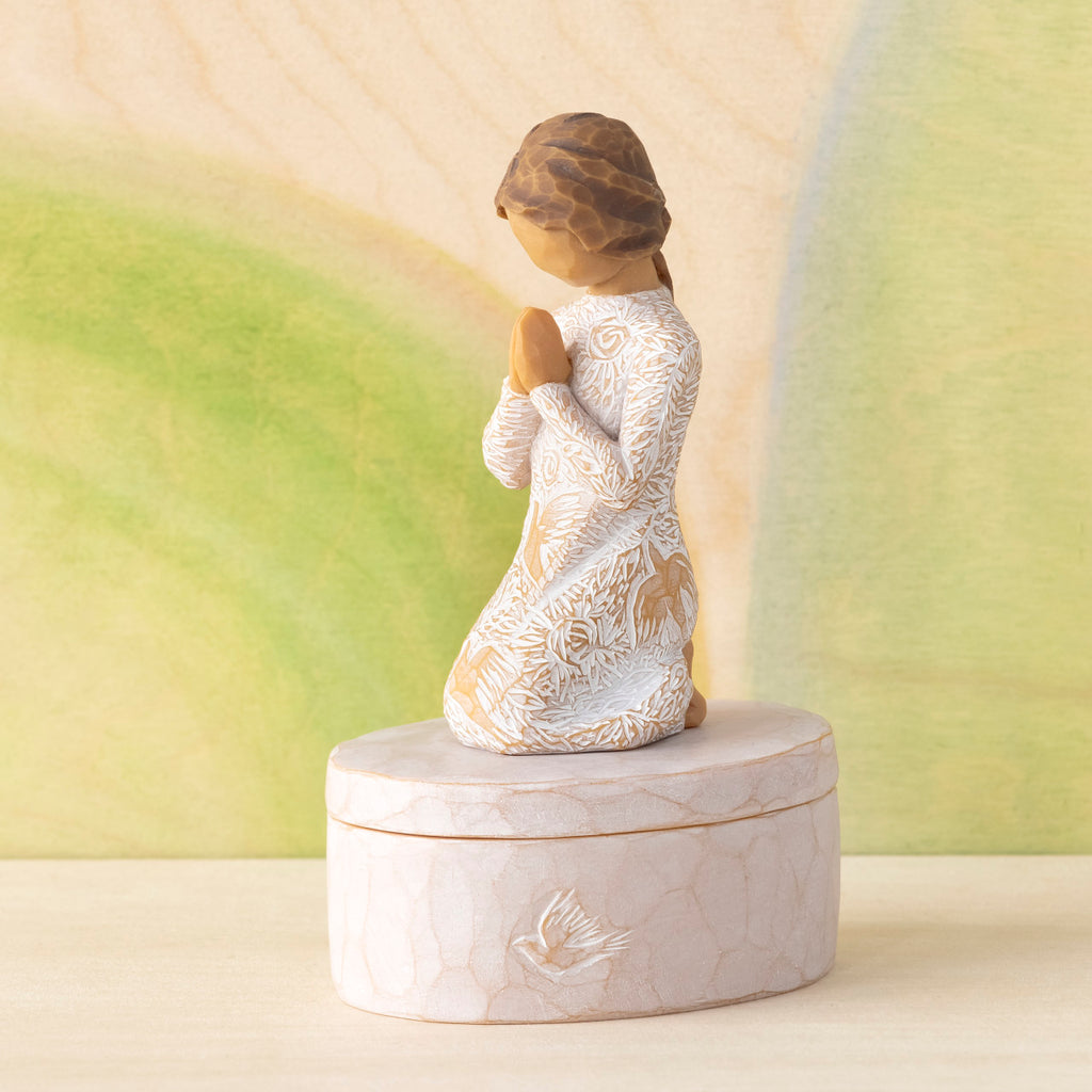 Willow Tree Prayer of Peace Keepsake Box, 3.5"oval hand-painted resin box with 3”H kneeling figure in cream dress carved with nature imagery, in prayer/meditation pose, affixed to lid, in front of green painting